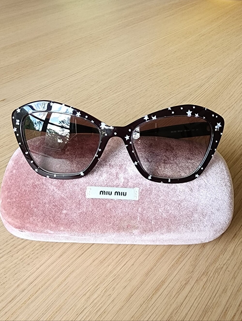 Miu Miu Women's Cat-Eye Black Sunglasses With White Star Pattern